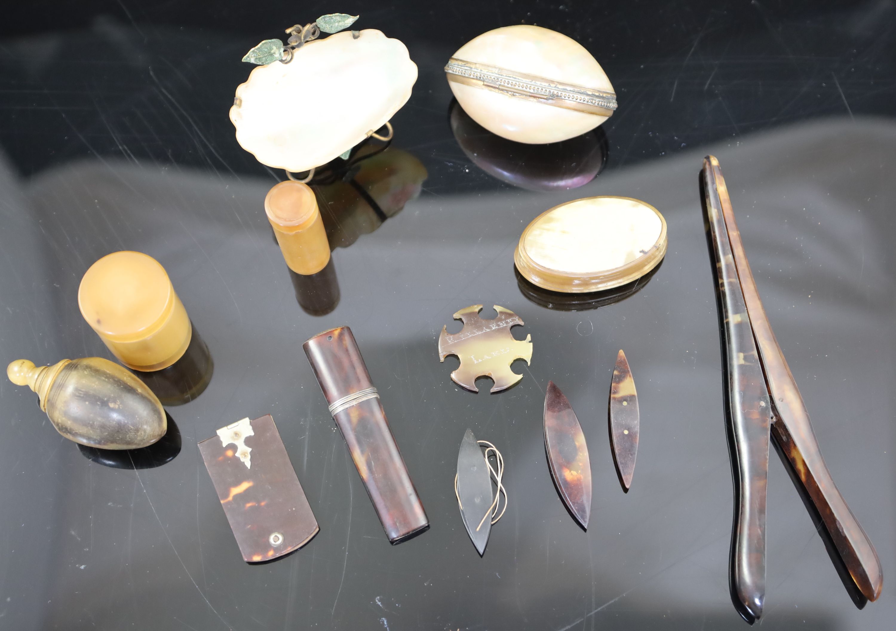 A collection of assorted tortoiseshell, horn and mother of pearl sewing accessories and other items